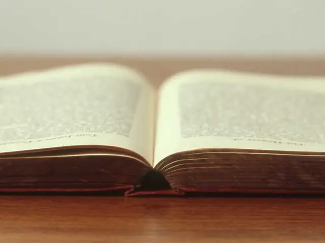 An open book on a wooden table